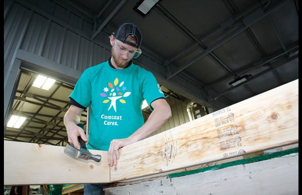 NASCAR Xfinity Series driver Harrison Rhodes participates in a Habitat for Humanity house build in Johnson City, Tenn.