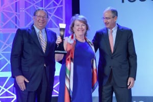 Woman of the Year D'Arcy Rudnay with Comcast CEO Brian Roberts and senior EVP David Cohen. (Photo by Larry Busacca, Getty Images)