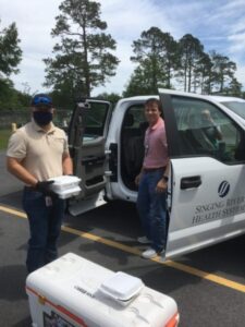 Sparklight employee delivering meals to hospital